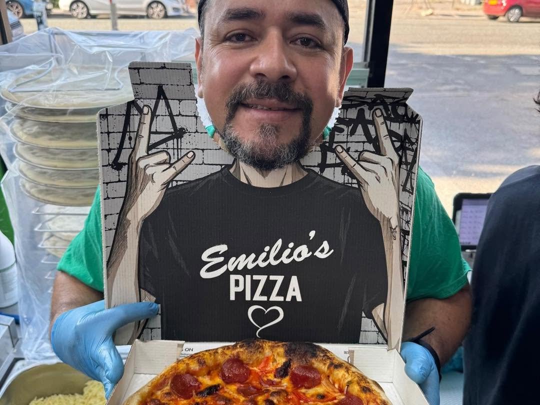 Emilios chef holding the branded pizza box tear-out photo prop