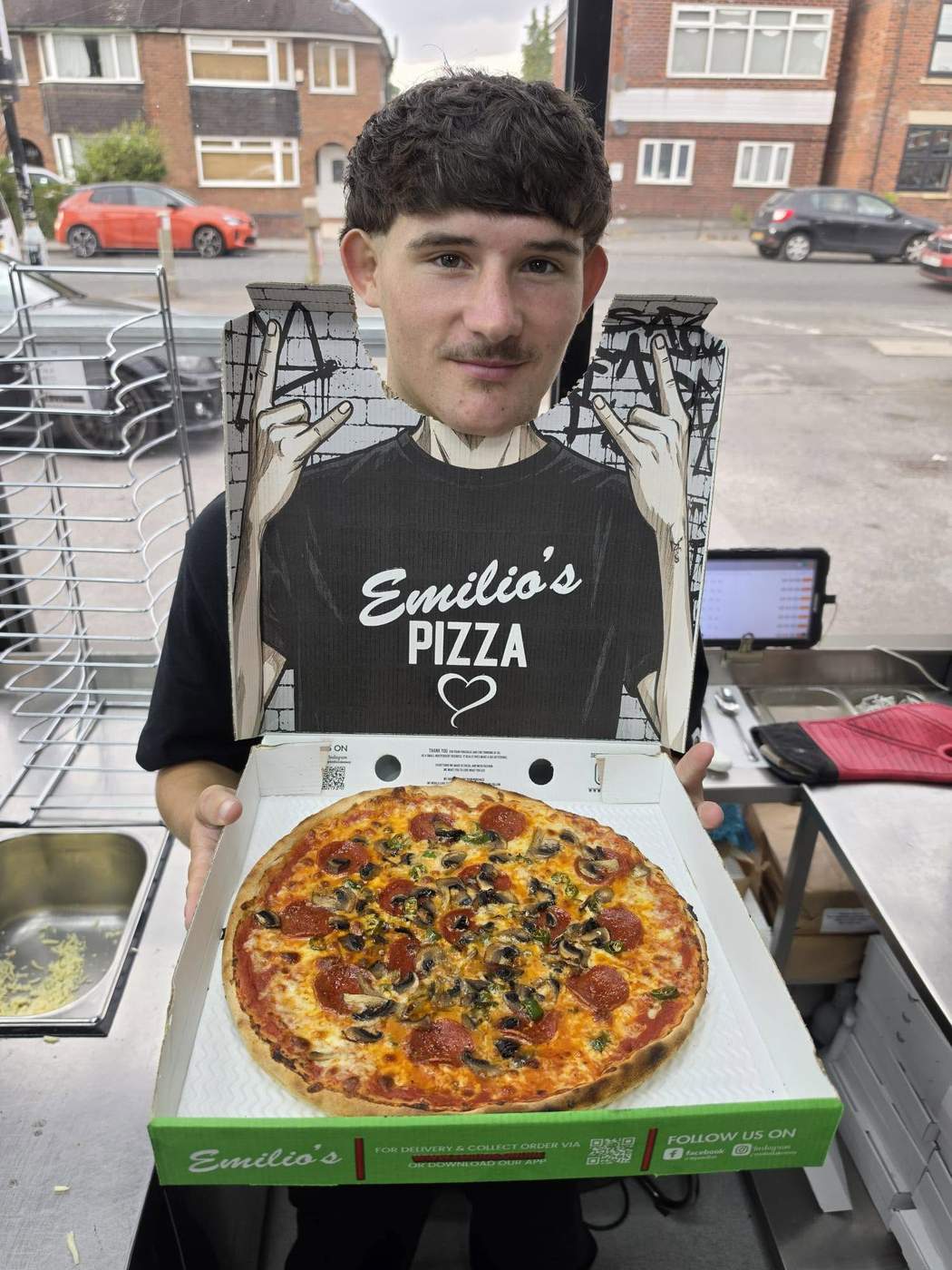 Emilios pizza box tear-out photo prop showing TAG US @MYEMILIOS above the face cut-out